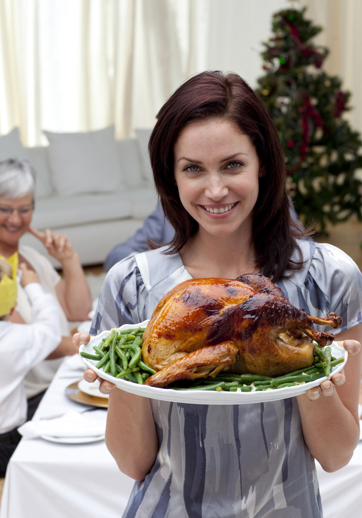 Happy Woman with cooked turkey