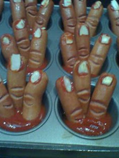 hot dogs shaped like fingers in muffin tins